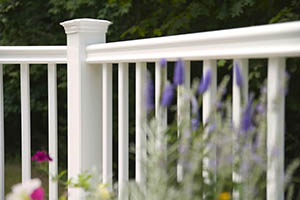 Deck Railing featuring TimberTech Impression Rail Express in White Composite with purple flowers