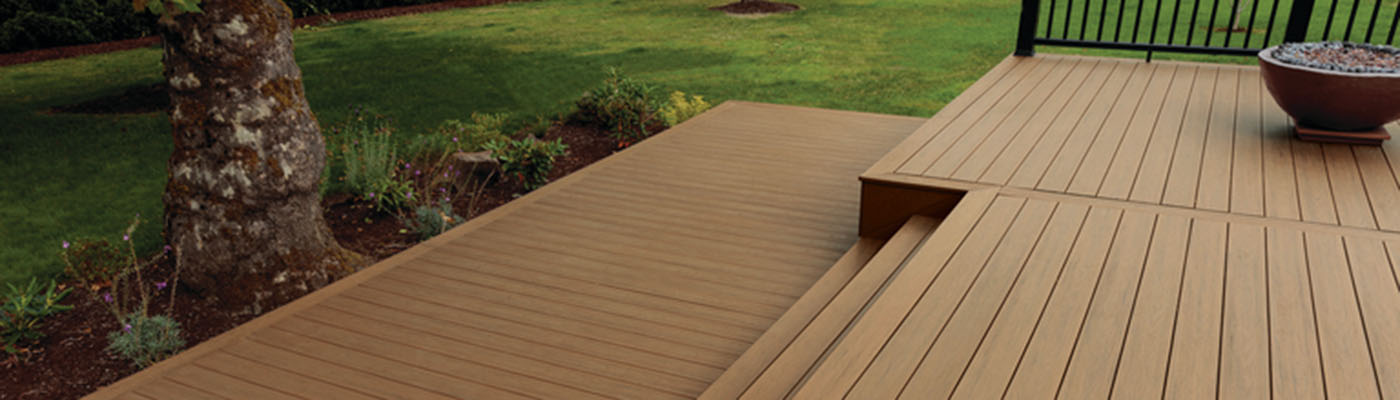 Brown vintage leather suitcase on a wooden deck lying flat viewed