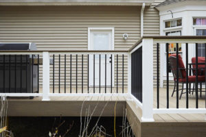 Mixed material railing system featuring Drink Rail in the Classic Composite Series by TimberTech