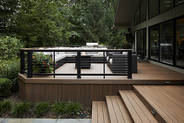 Composite deck board colors for a woodland retreat