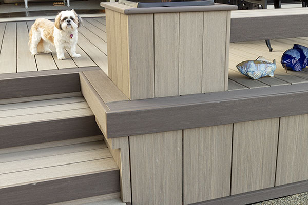 Using a deck board as fascia and a picture frame to cover decking end-cuts