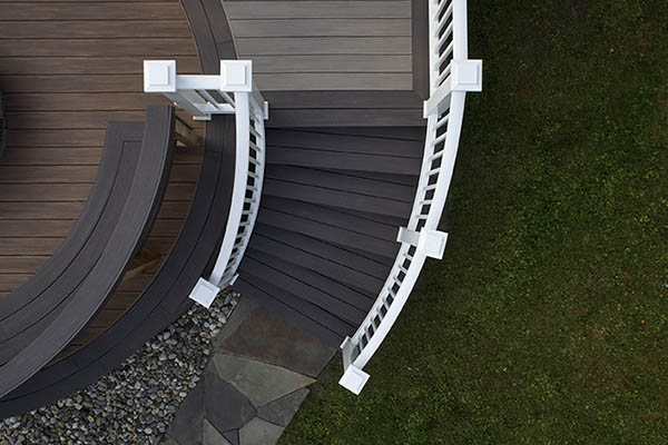 Curved, white outdoor stair railing