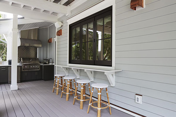 Covered deck designs featuring a built-in bar area