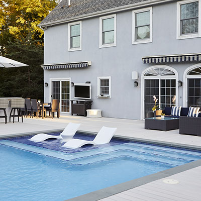 Deck color ideas featuring light decking are ideal for pool builds