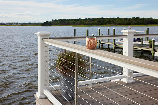 Modern deck designs featuring railing with cable infill