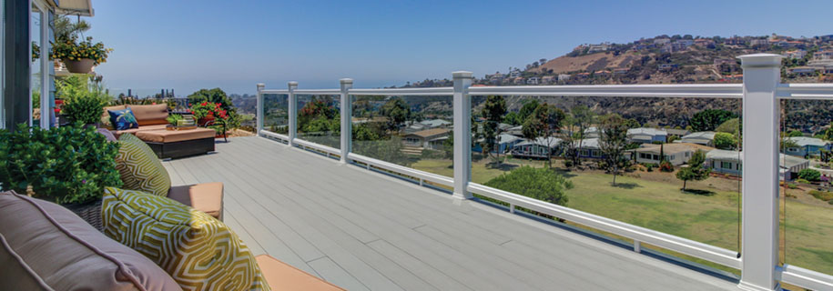 Modern deck railing ideas featuring glass panel infills