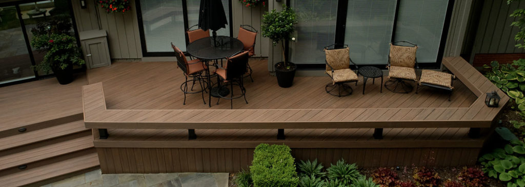 Built in deck benches for deck bench ideas on a wide furnished deck with planters and table