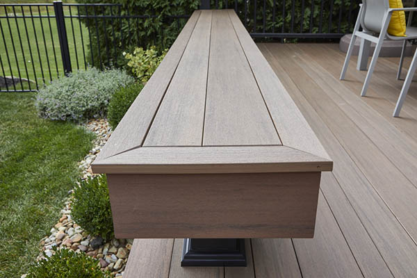 Built in deck benches featuring large composite wood bench and matching deck