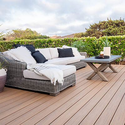 Sunny deck ideas with cloudy sky and furnished composite deck