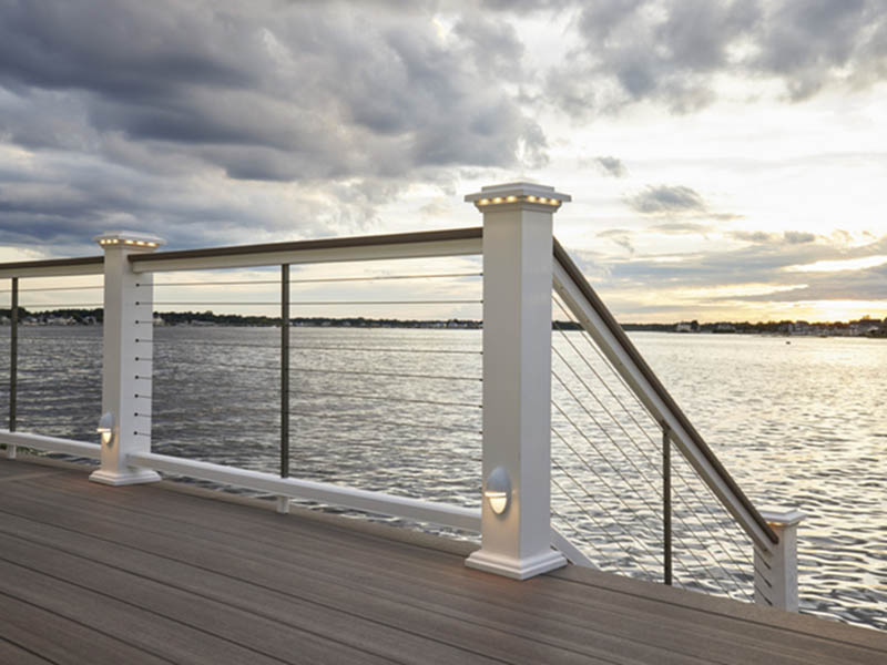 Deck ideas on cloudy waterfront deck with railing