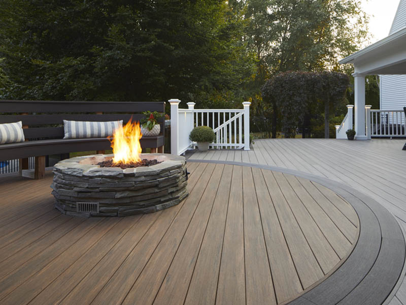 Deck ideas with multi-colored boards and firepit