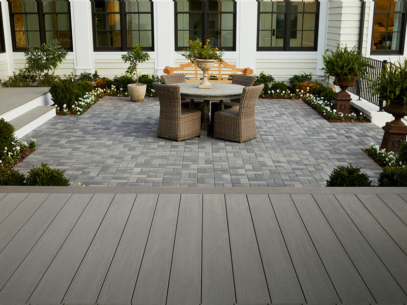Sunken deck ideas with planters and patio furniture behind home