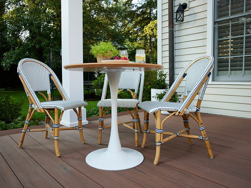 Deck ideas with round patio table and three chairs on a deck