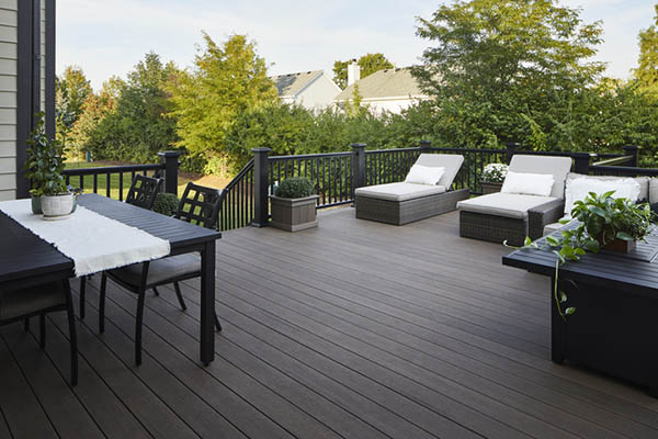 How to plan a deck project with shady furnished outdoor deck and lush lawn