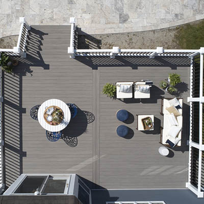 How to plan a deck project with aerial view of furnished backyard deck
