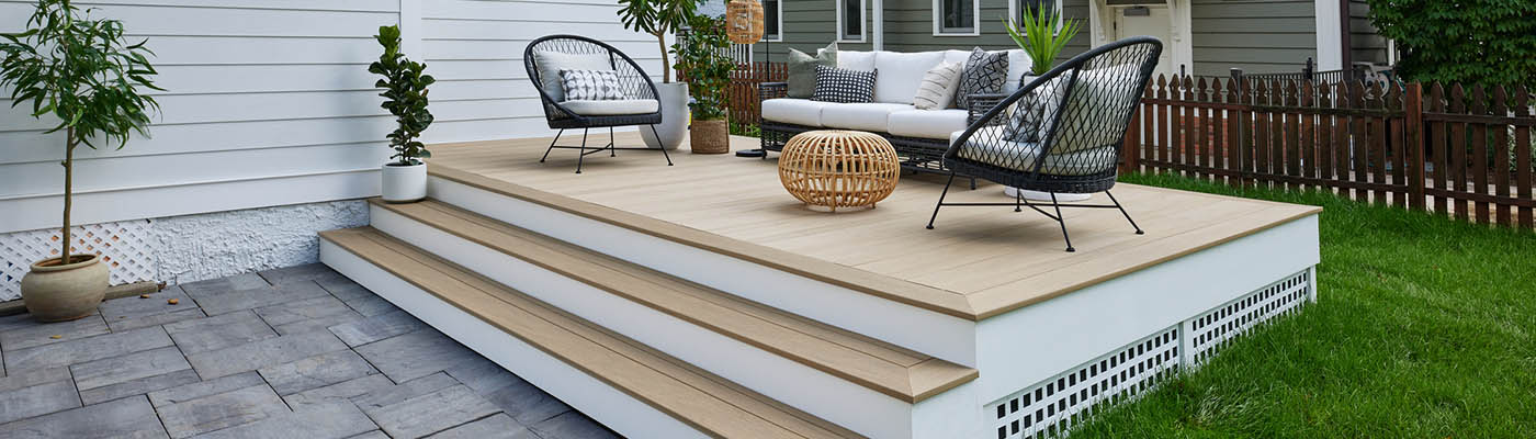 How to plan a deck project with a furnished raised backyard deck
