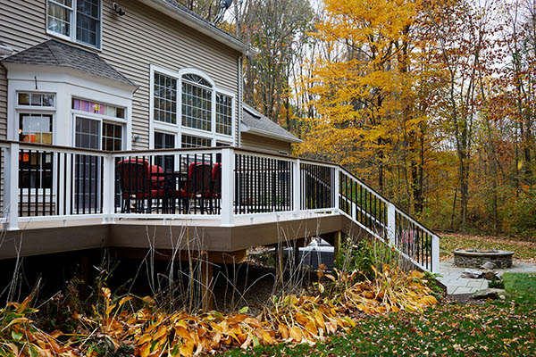 A composite deck with a three-toned railing