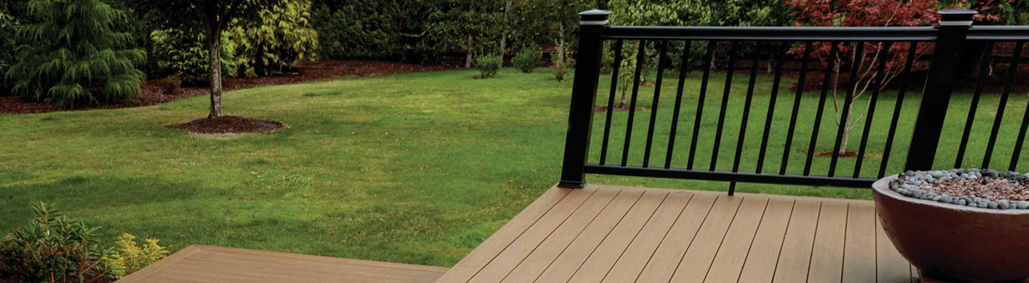 Low composite deck featuring Antique Leather boards and RadianceRail