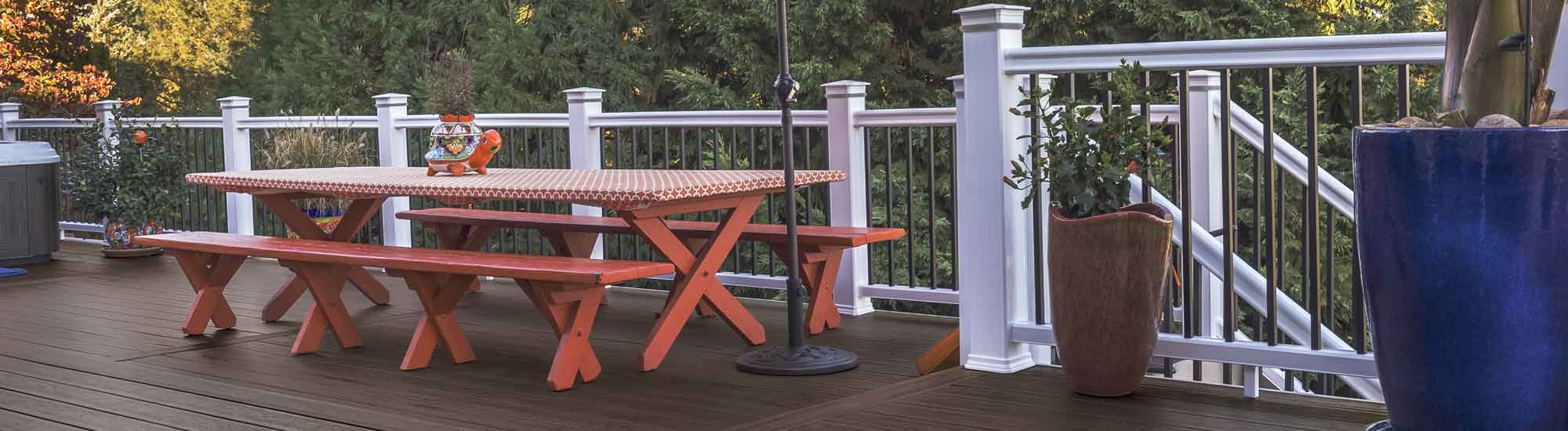 A composite deck featuring Dark Roast boards and RadianceRail