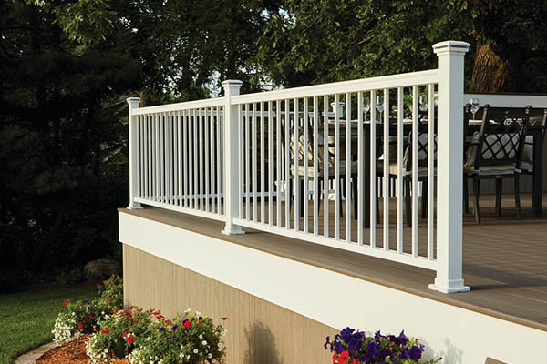 Deck railing ideas and deck baluster ideas with forest-lined second story deck