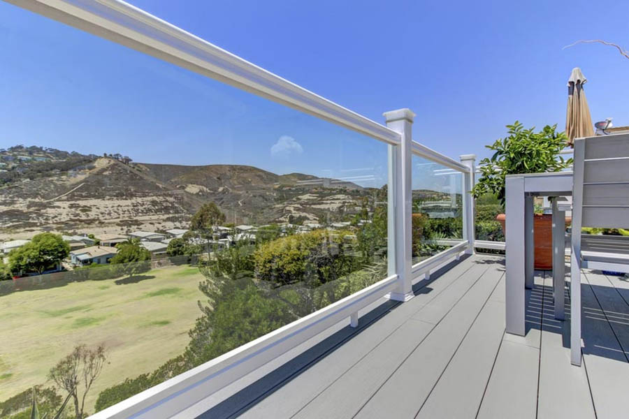 Railing with glass balusters overlooking rural city