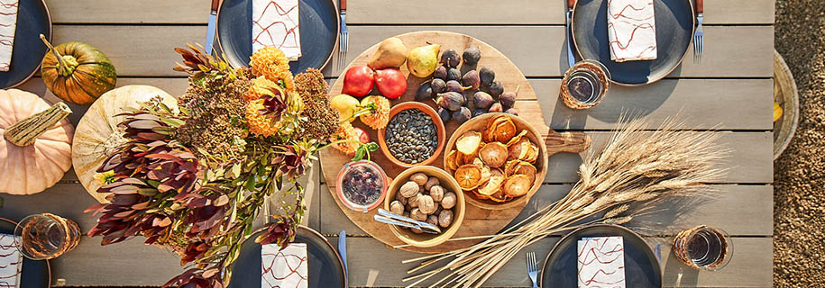 Fall outdoor porch decor ideas featuring a harvest inspired tablescape
