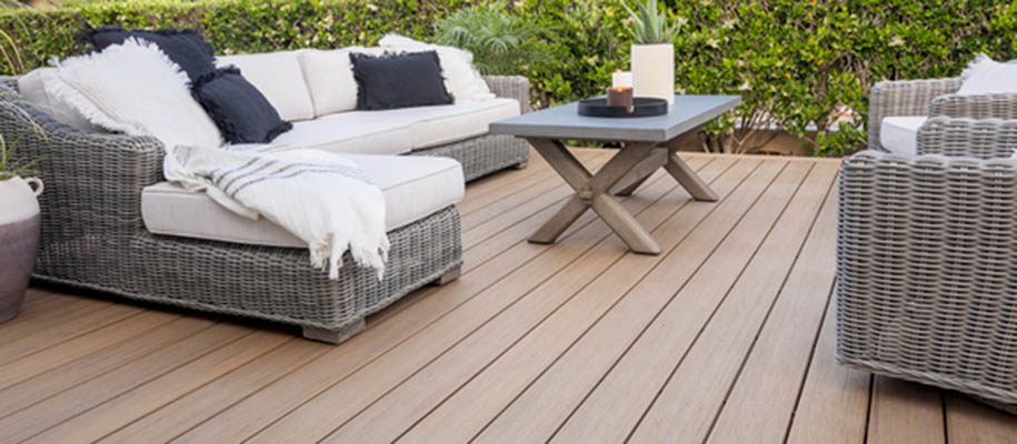 Outdoor fall activities with wicker couch on Antique Leather composite deck