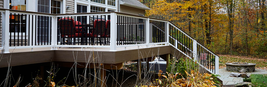Outdoor fall activities at home with leaves under composite deck