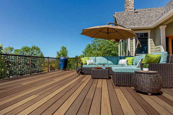 Two tone deck color schemes and deck color combinations on furnished deck with giant patio umbrella