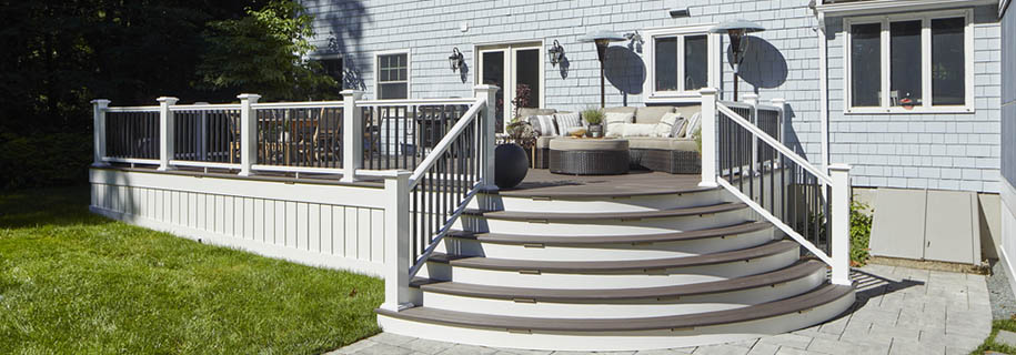 Installing PVC trim boards creates contrast with richly hued decking