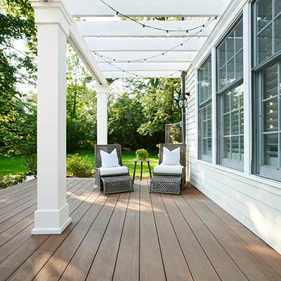 Installing PVC trim boards as column wraps on a pergola