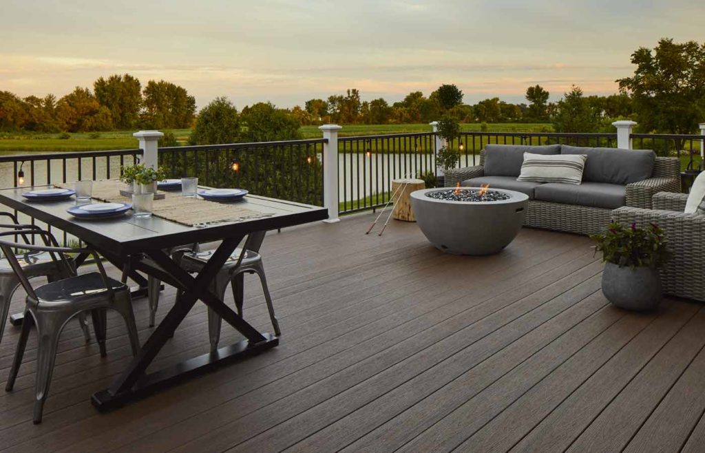 Composite deck with fire pit at sunset