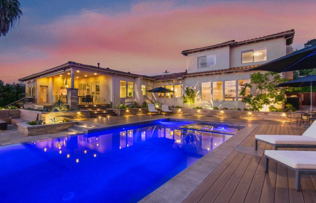 Spanish mission house & poolside deck at night