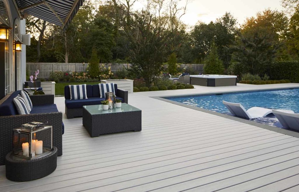 Hamptons-style light gray deck with pool