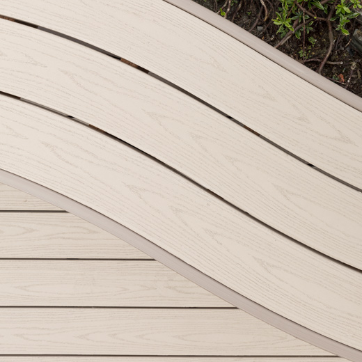 Close-up composite deck with built in bench made of Brownstone decking
