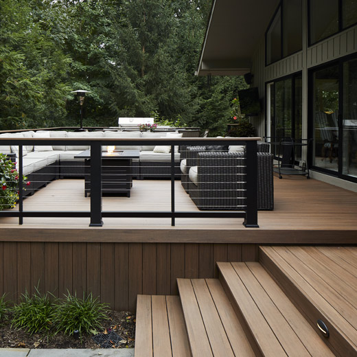 Composite deck made of English Walnut decking on a craftsman home
