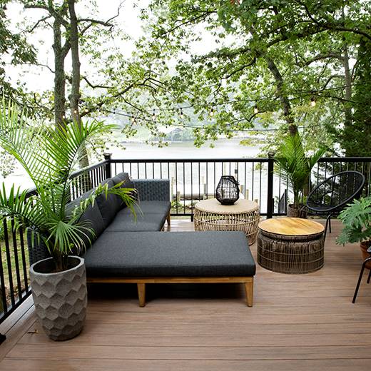Raised riverside composite deck featuring English Walnut decking