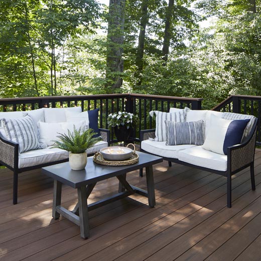 Composite deck in forested area with Mahogany decking