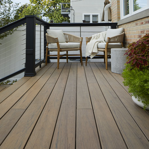 Small cozy composite deck with light brown Pecan decking