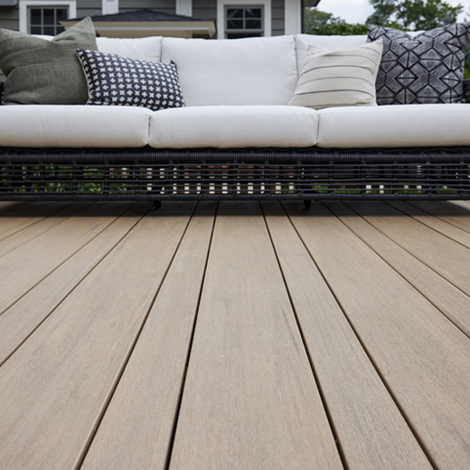Detail shot of a deck featuring Weathered Teak Multi Width Decking boards