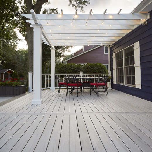 Pergola built over dining area on a composite deck