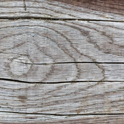 Deck damage can be seen in a wood deck's ledger board