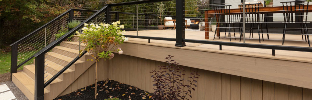 Black composite railing with cable rail infill allows for clear sightlines