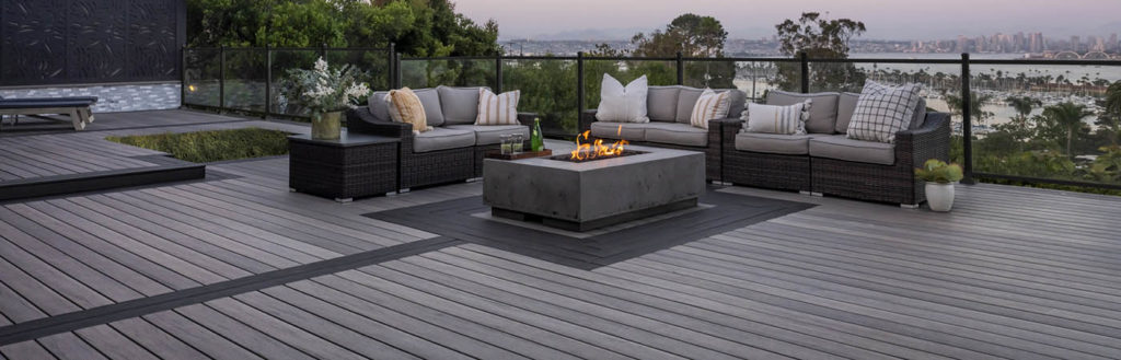 A sleek black metal railing suits a high rise deck with a view