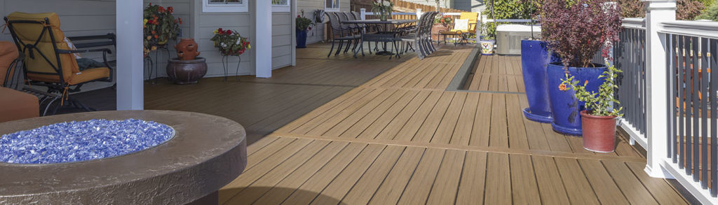 A sprawling deck with warm tan Coconut Husk decking