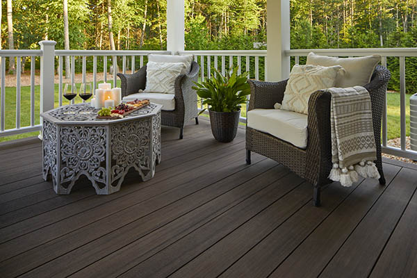 Cozy deck with elegant furniture and a crisp white composite railing