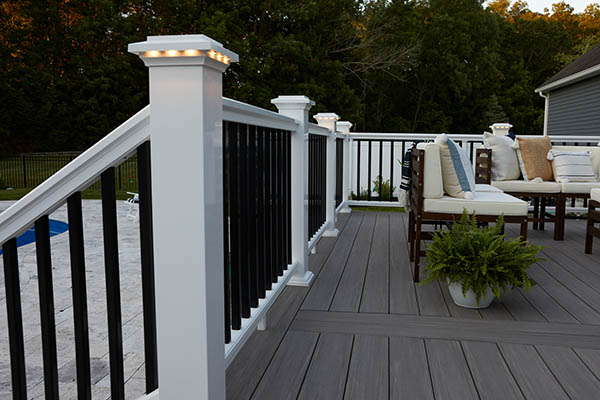 Small outdoor spaces benefit from rail lighting for ambiance