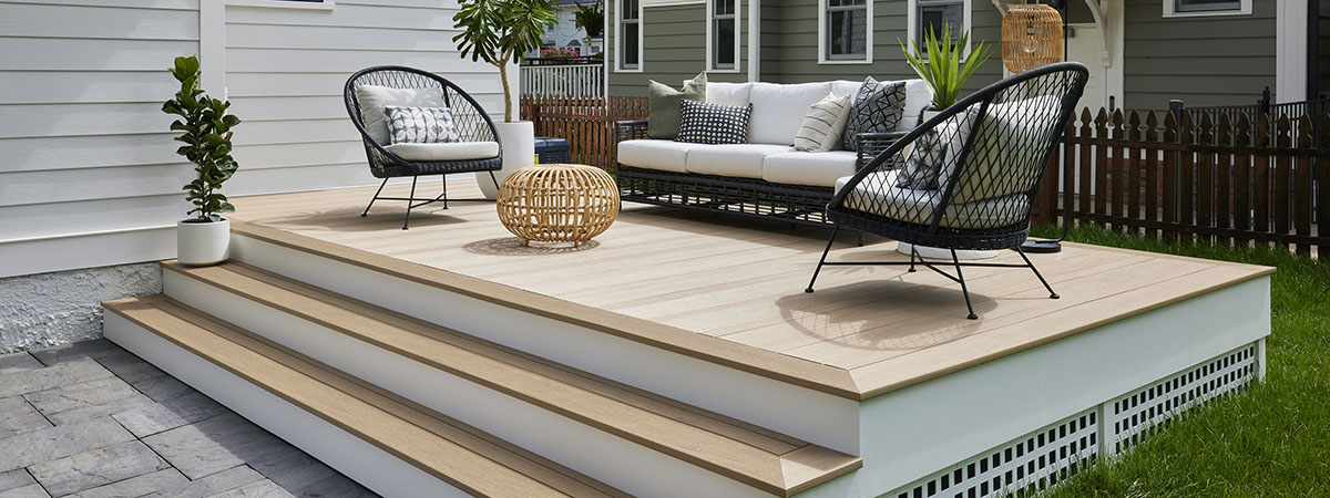 https://www.timbertech.com/wp-content/uploads/2022/03/Small-Outdoor-Space-Ideas-TimberTech-Weathered-Teak-Vintage-Collection-AZEK-Multi-Width-Decking-Small-Low-Deck-Hero.jpg