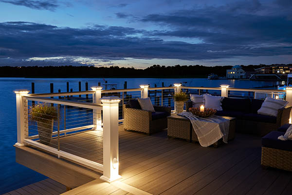 Deck lights along the railing of a bayside composite deck