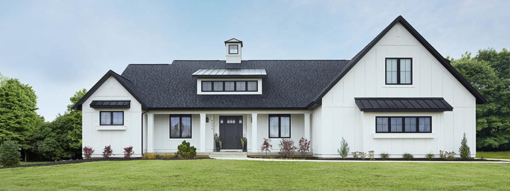 Modern farmhouse-style front porch design ideas featuring a stark black and white home